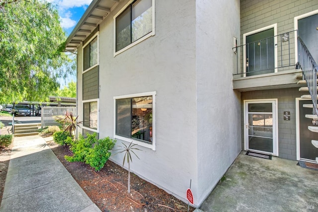 view of side of property featuring stucco siding