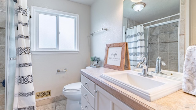 full bath with visible vents, toilet, tile patterned floors, vanity, and tiled shower