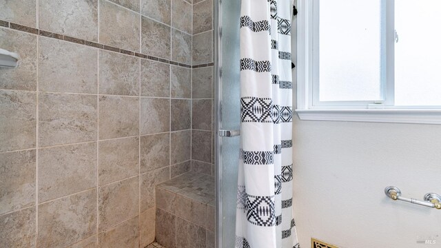 full bath with a shower stall