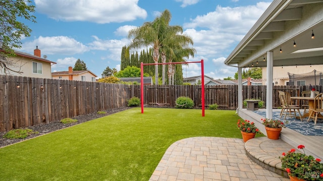view of yard with a patio and a fenced backyard
