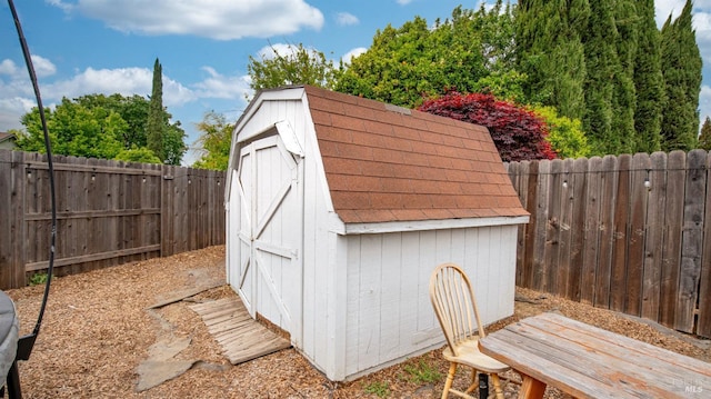 view of shed with a fenced backyard