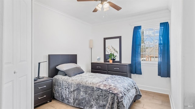 bedroom featuring ceiling fan, ornamental molding, and baseboards