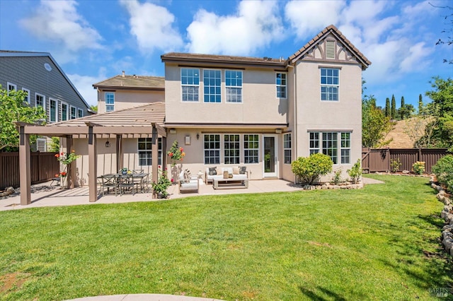 rear view of property with stucco siding, outdoor lounge area, a fenced backyard, a patio area, and a yard