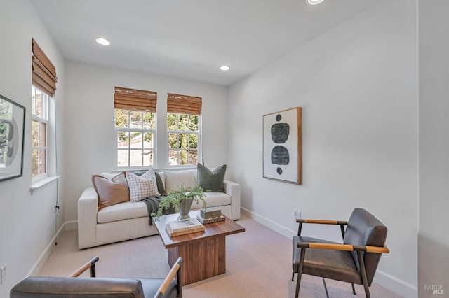 living area with carpet floors, recessed lighting, baseboards, and plenty of natural light