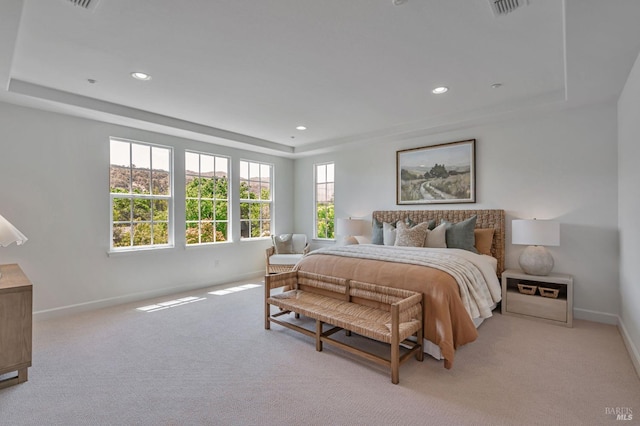 bedroom featuring baseboards, a tray ceiling, recessed lighting, and light colored carpet