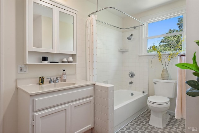 bathroom featuring vanity, shower / bath combo with shower curtain, and toilet