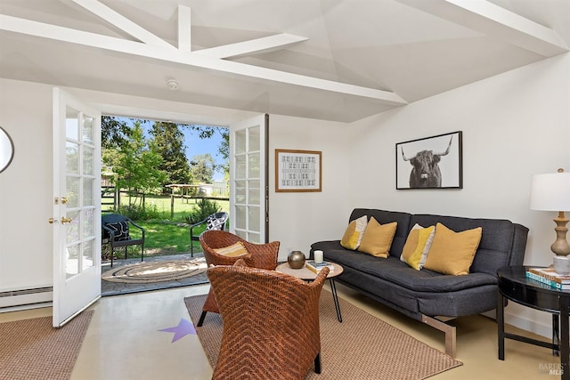living area with finished concrete floors, lofted ceiling, and baseboard heating