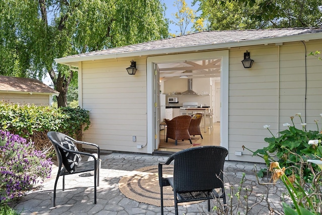 view of patio with an outbuilding