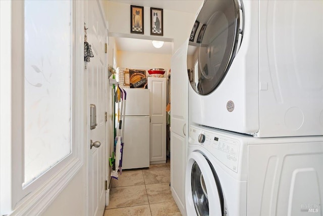laundry room featuring stacked washer and clothes dryer