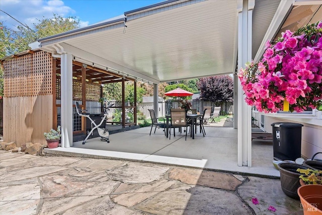view of patio / terrace with a fenced backyard and outdoor dining space