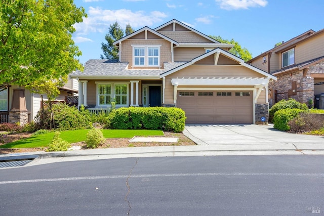 craftsman inspired home featuring driveway, stone siding, and a garage