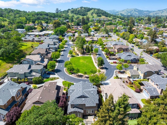 drone / aerial view featuring a residential view and a mountain view