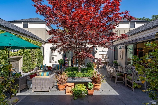view of patio featuring outdoor dining space and an outdoor hangout area