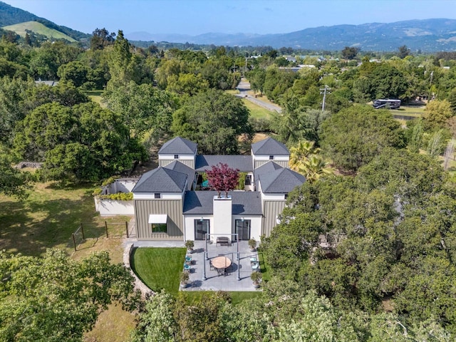bird's eye view featuring a mountain view and a forest view