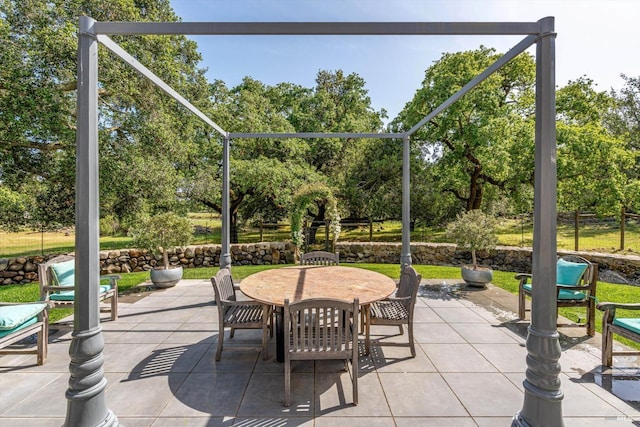 view of patio featuring outdoor dining area