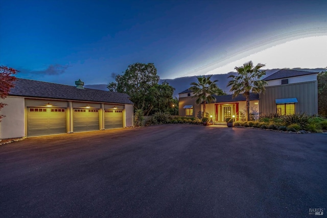 view of front of house featuring a garage and a mountain view