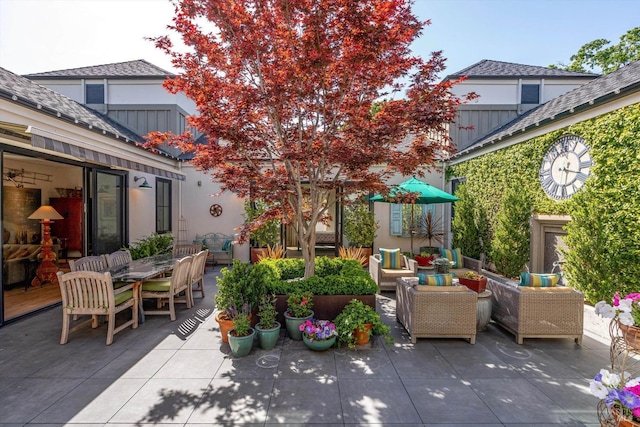 view of patio / terrace with an outdoor living space and outdoor dining area