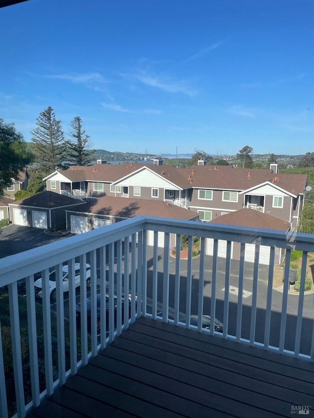 wooden deck featuring a residential view