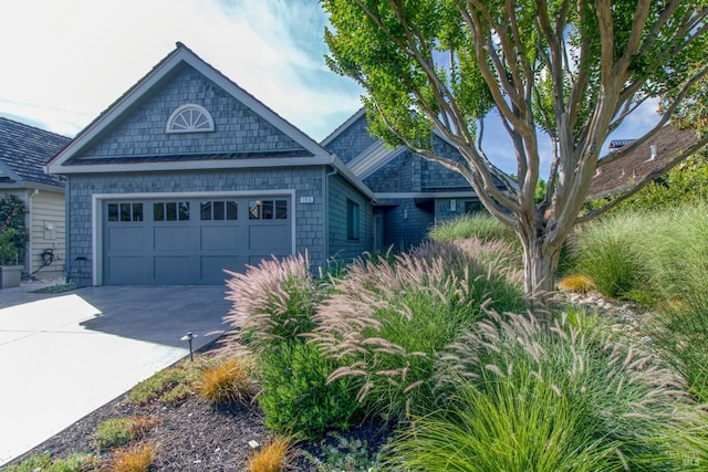 view of front facade featuring concrete driveway and an attached garage