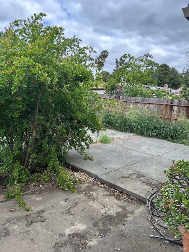 view of patio / terrace featuring fence