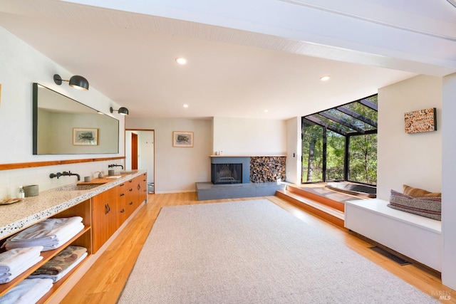 2200 Mcnab Ranch Rd, Ukiah, CA 95482 - living area featuring light wood-style floors, a fireplace with raised hearth, recessed lighting, and visible vents