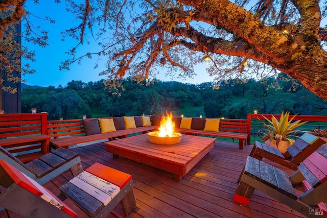2200 Mcnab Ranch Rd, Ukiah, CA 95482 - deck with an outdoor living space with a fire pit and a view of trees