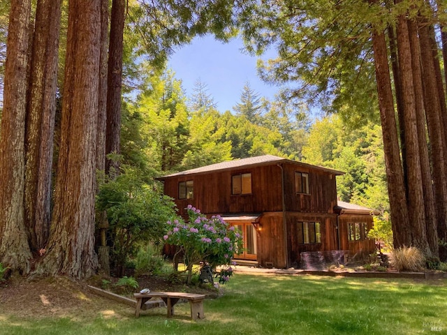 view of outbuilding with a wooded view