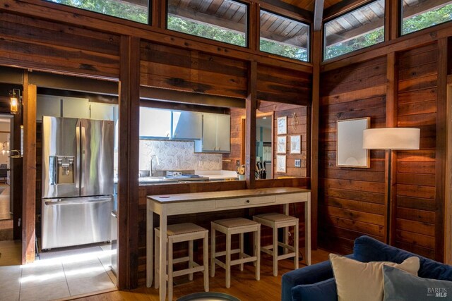 interior space featuring wood walls and light wood-style floors