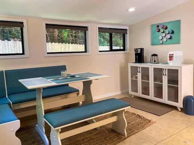 office space with tile patterned flooring and baseboards