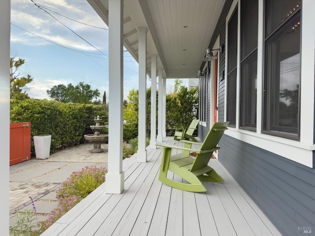 wooden terrace featuring a porch