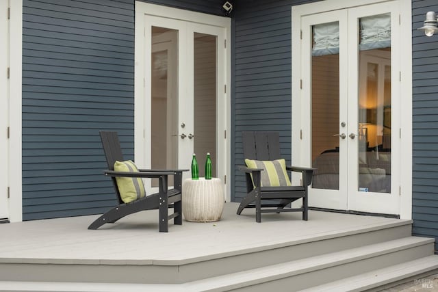 view of exterior entry featuring french doors