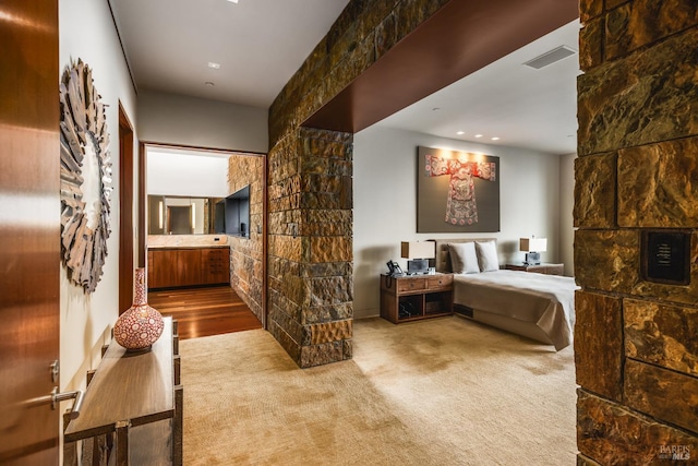 carpeted bedroom with visible vents