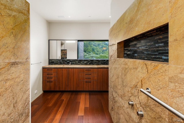 bathroom featuring wood finished floors and vanity