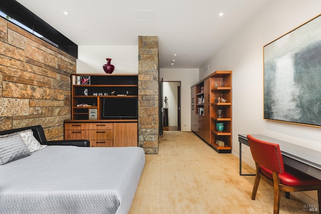 bedroom with visible vents, baseboards, and light carpet