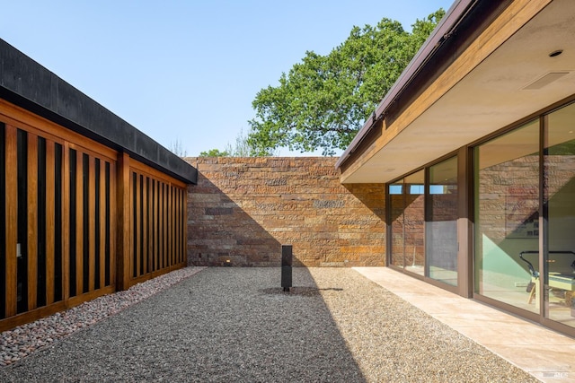 exterior space with fence and a patio area