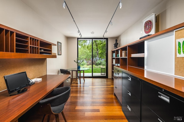 office area featuring track lighting, floor to ceiling windows, and wood finished floors