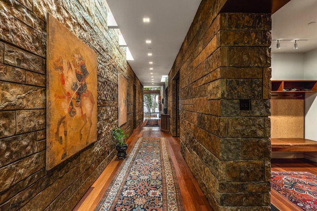 corridor with wood finished floors