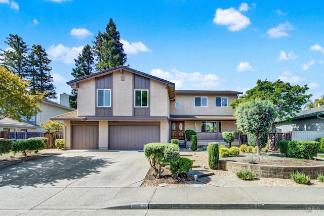 3237 Arroyo Dr, Fairfield, CA 94533 - view of front of house with a garage, driveway, stucco siding, and a porch