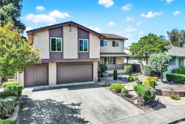 contemporary home featuring stucco siding, driveway, and an attached garage