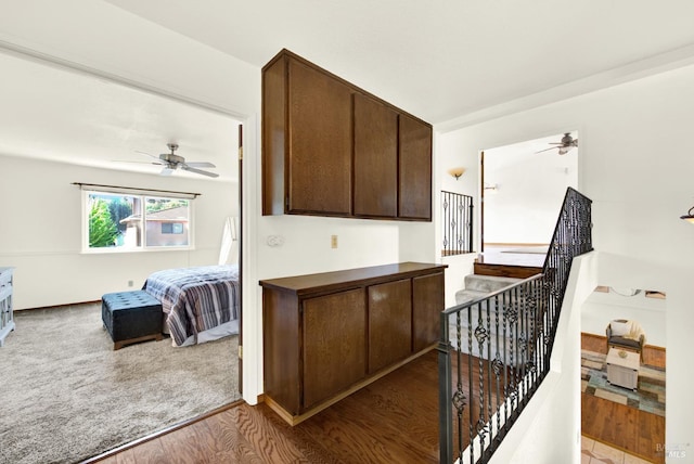 interior space with ceiling fan and wood finished floors
