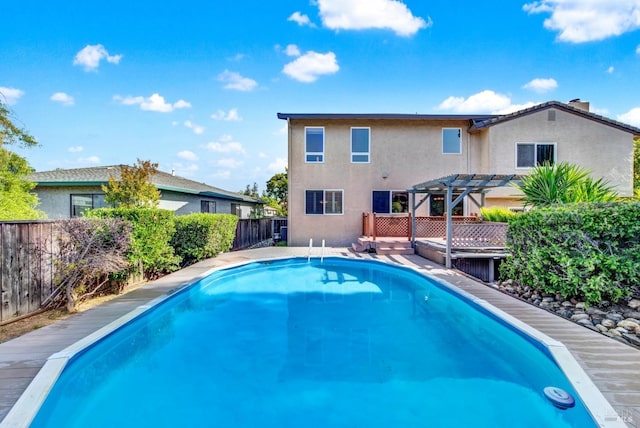 3237 Arroyo Dr, Fairfield, CA 94533 - view of swimming pool featuring a pergola, a fenced backyard, and a deck