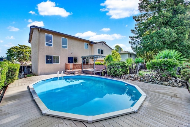 3237 Arroyo Dr, Fairfield, CA 94533 - view of swimming pool featuring a pergola, a wooden deck, and fence