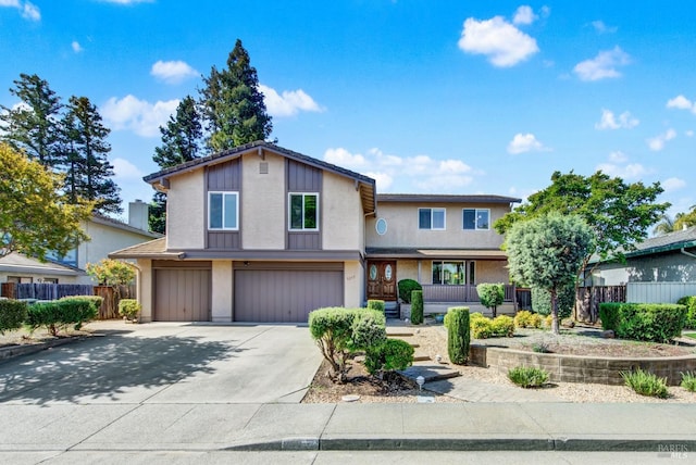 view of front of property with a porch, a garage, concrete driveway, stucco siding, and fence