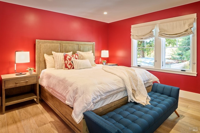 bedroom with baseboards, recessed lighting, and wood finished floors