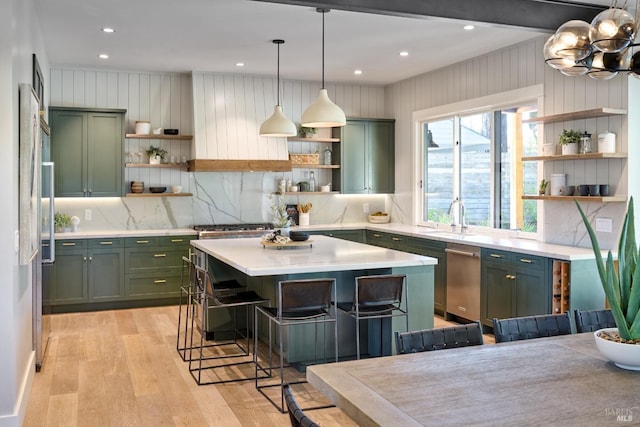 kitchen with green cabinetry, a sink, and open shelves