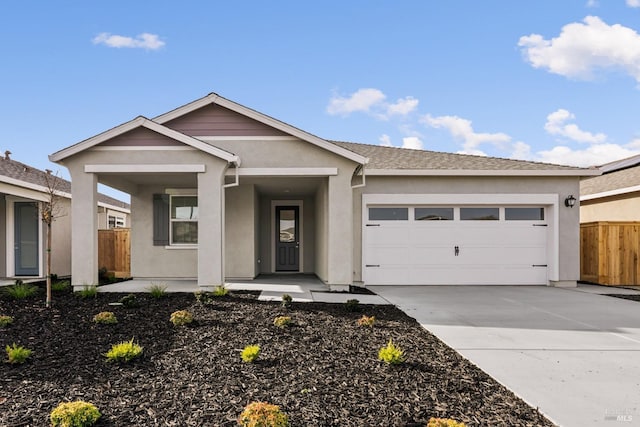 single story home featuring a porch, stucco siding, fence, driveway, and an attached garage