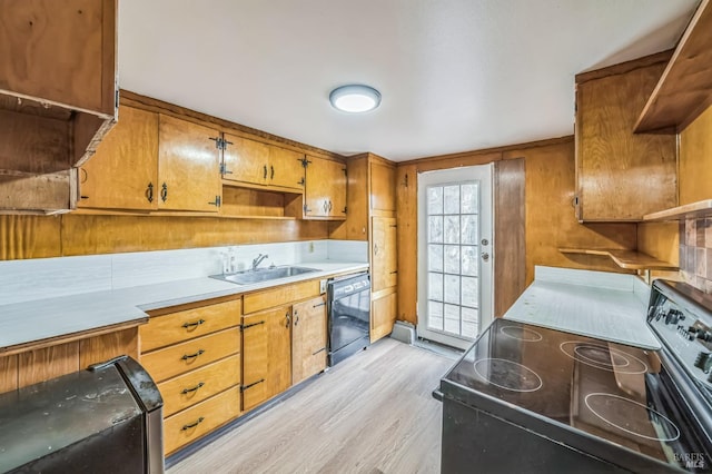 kitchen with brown cabinets, dishwasher, light wood finished floors, a sink, and stainless steel range with electric stovetop