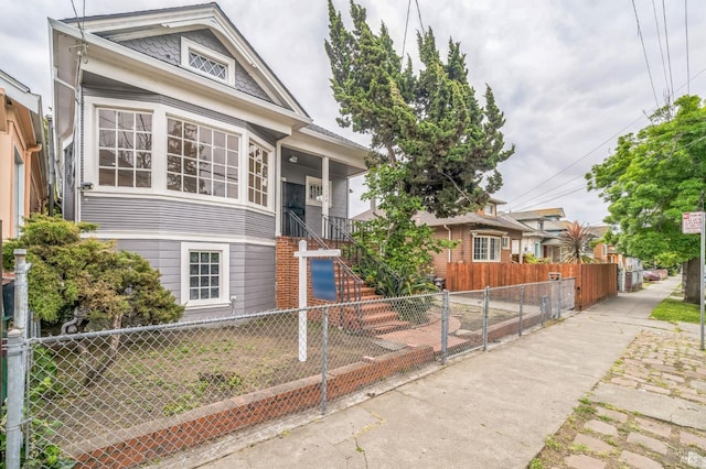 bungalow with a fenced front yard