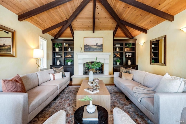 living room featuring a fireplace with raised hearth, built in shelves, wooden ceiling, and wood finished floors