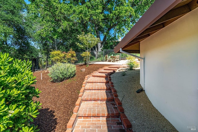 view of yard with a patio and fence